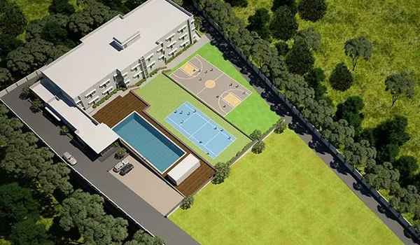 Chrysalis High School, Bannerghatta Road, Bangalore — campus seen from above, with the classroom block, swimming pool, tennis and basketball courts and playing field