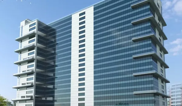 Velankani Tech Park, Bangalore — blue-glass office tower with projecting balcony bays at each end of the elevation